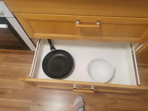 a frying pan and a pot in a drawer at Apartment Renata Irdning Pichlarn in Aigen im Ennstal