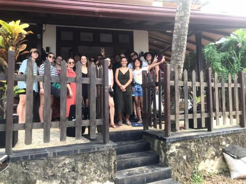 a group of people standing on a fence at Ocean Breeze Villa in Matara