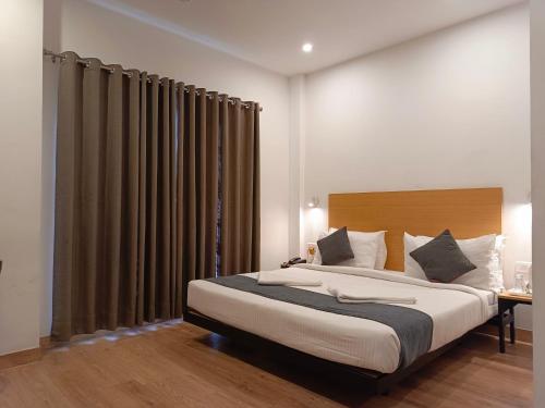 Postel nebo postele na pokoji v ubytování SM Hives Business Hotel