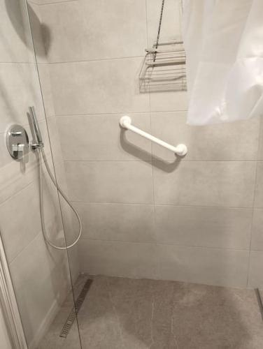 a shower in a bathroom with a glass door at Appartamento B&B Cà Betty in Calderara di Reno