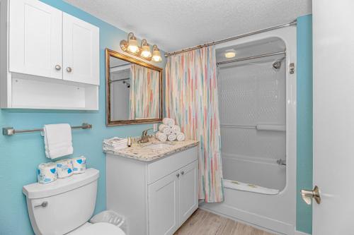 a bathroom with a toilet and a sink and a shower at Immaculate! Beautifully Renovated Oceanfront 1 Bedroom Suite - Sleeps 6! - Roxanne Towers Unit 804 in Myrtle Beach