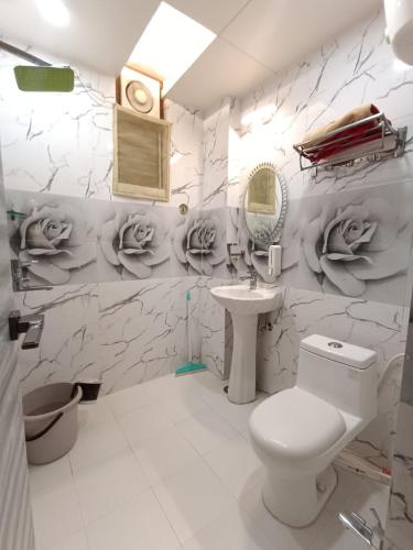 a bathroom with a toilet and a sink at STAY DAILY INN in Varanasi