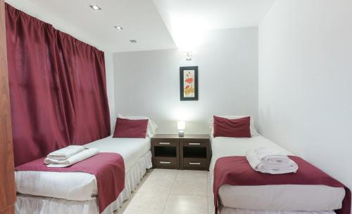 מיטה או מיטות בחדר ב-Cabañas Tierra Mistica