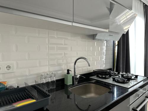 a kitchen with a sink and a counter top at Anka recidence in Istanbul