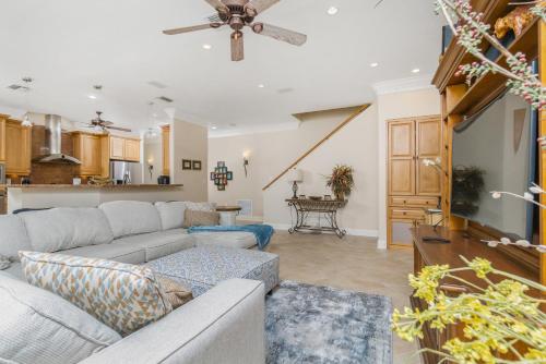 a living room with a couch and a kitchen at Villa Hibiscus-Waterfront-Punta Gorda FL in Punta Gorda