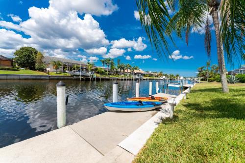 a couple of boats are sitting on the water at Villa Hibiscus-Waterfront-Punta Gorda FL in Punta Gorda