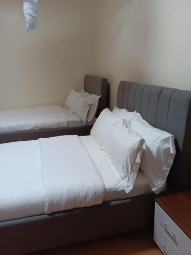 Een bed of bedden in een kamer bij La cafecito Bistro & Accommodation