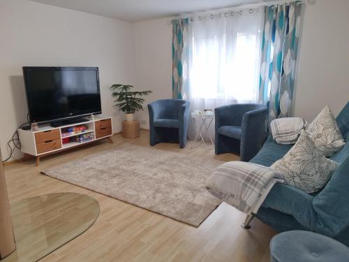 TV a/nebo společenská místnost v ubytování Ferienhaus Alexandra