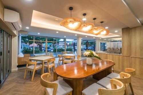 a dining room with a table and chairs at Aonang All Seasons Beach Resort in Ao Nang Beach