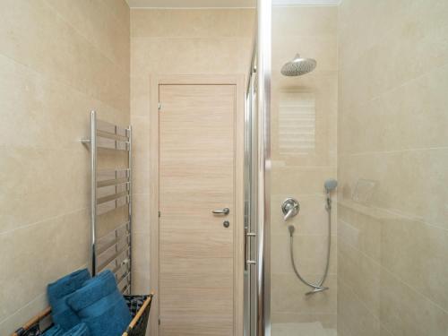 a shower in a bathroom with a glass door at Villa Pero & Jele in Mlini