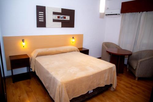 Postel nebo postele na pokoji v ubytování Hotel Internacional