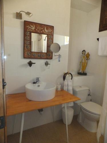 a bathroom with a sink and a toilet at Río Mundo Alojamiento Rural in Riópar