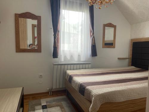 Postel nebo postele na pokoji v ubytování LUX Apartman Hedonic