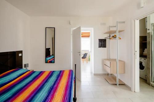 Ένα ή περισσότερα κρεβάτια σε δωμάτιο στο L'ANFORA DELLE MURELLE