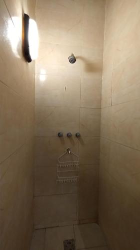 a bathroom with a shower with a light on it at 3 Ambientes Mar del Plata in Mar del Plata