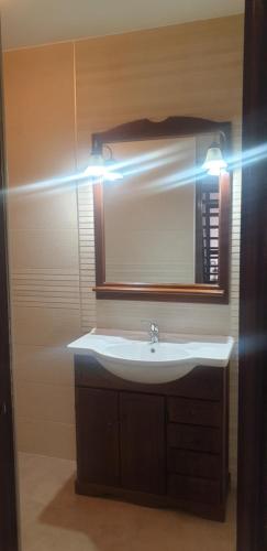 a bathroom with a sink and a mirror at Casa Telares Ávila in Avila