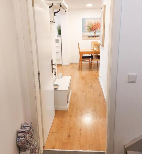 a hallway with a desk and a table in a room at Haus am See in Heddesheim