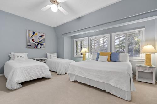 Ένα ή περισσότερα κρεβάτια σε δωμάτιο στο Dune Breeze