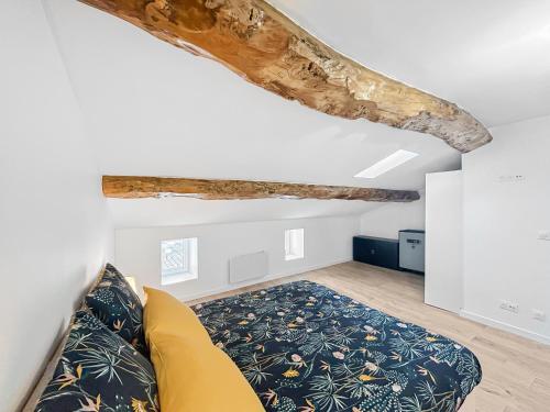 Ένα ή περισσότερα κρεβάτια σε δωμάτιο στο Le Loft de Saintonge