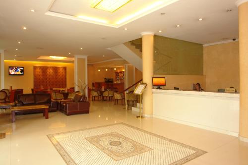 a lobby with a waiting area and a lobby at Dreamliner Hotel in Addis Ababa