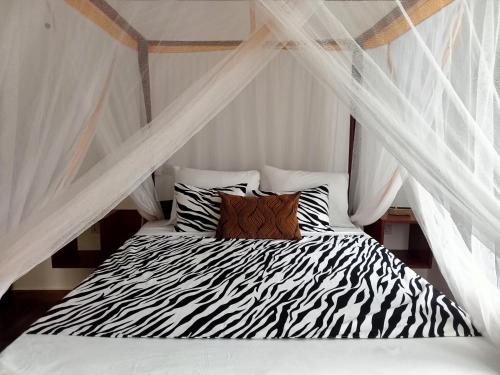 Un ou plusieurs lits dans un hébergement de l'établissement Zanzibar Dream Lodge