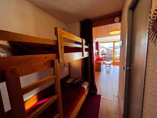 a room with two bunk beds and a hallway at Studio Les Saisies, 1 pièce, 4 personnes - FR-1-293-193 in Les Saisies