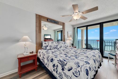 a bedroom with a bed with a view of the ocean at Phoenix 1093 in Orange Beach