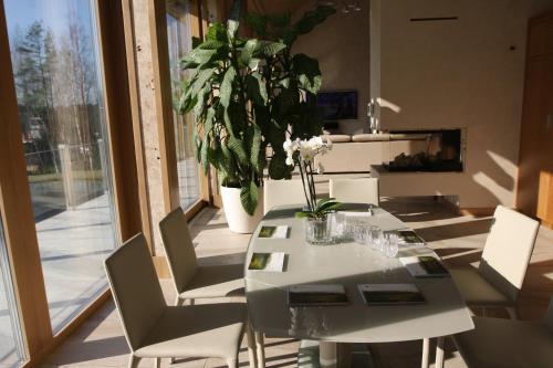 a dining room with a table and chairs at Kernavės Pajauta in Kernavė