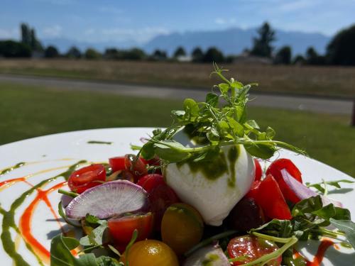 a plate of food with vegetables on it at Starling Hotel Lausanne in Lausanne