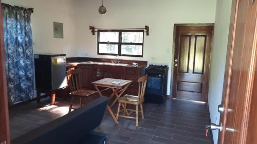 a kitchen with a table and chairs and a sink at Mahogany Villas in Punta Gorda
