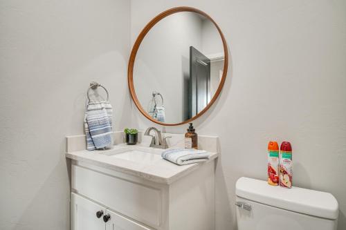 a bathroom with a sink and a mirror at Near Shangri-La Lake-View Monkey Island Home! in Afton