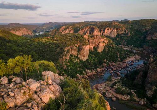 an aerial view of a river in a canyon at The Outpost in Makuleke Contract Park