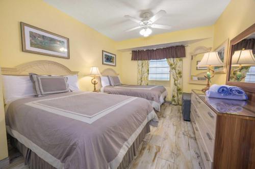 Ένα ή περισσότερα κρεβάτια σε δωμάτιο στο Luxury 14th Floor 1 BR Condo Direct Oceanfront Wyndham Ocean Walk Resort Daytona Beach | 1403