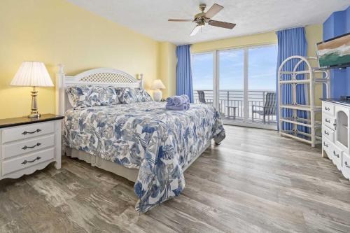 a bedroom with a bed and a view of the ocean at Luxury 6th Floor 2 BR Condo Direct Oceanfront Wyndham Ocean Walk Resort Daytona Beach | 601 in Daytona Beach