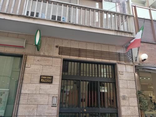 a building with a sign that reads new trial museum at Lusitana Alloggi in Foligno