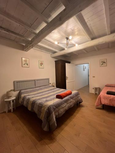 a bedroom with a large bed in a room at Agriturismo La Torre Di Monsindoli in Siena