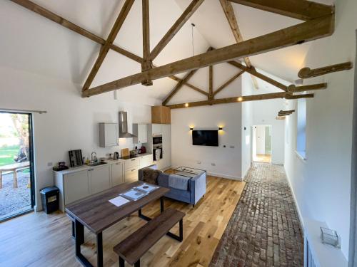 a living room with a table and a couch at Beaumont Mews in St. Albans