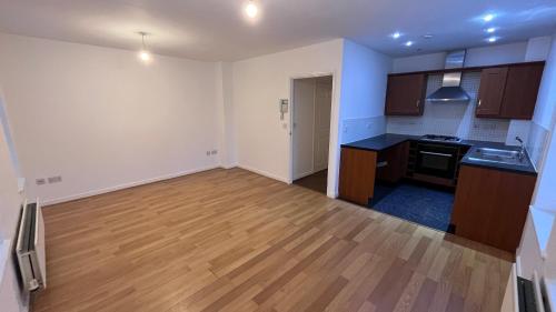 A kitchen or kitchenette at Maple Apartments