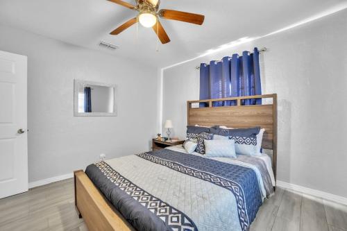 a bedroom with a bed with a ceiling fan at Cozy Plant City Home in Plant City