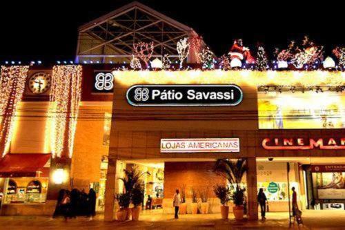a store with christmas lights on top of it at Flat Perto de Tudo na Savassi in Belo Horizonte