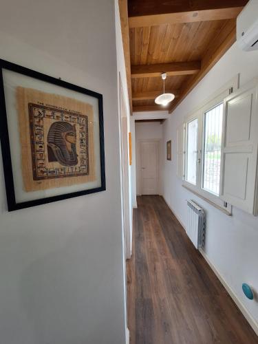 a hallway of a house with a picture on the wall at Case Vacanza Pianoneve in Buseto Palizzolo