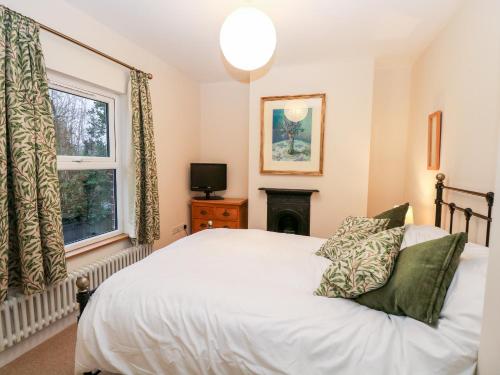 Ένα ή περισσότερα κρεβάτια σε δωμάτιο στο 6 Melinda Cottage
