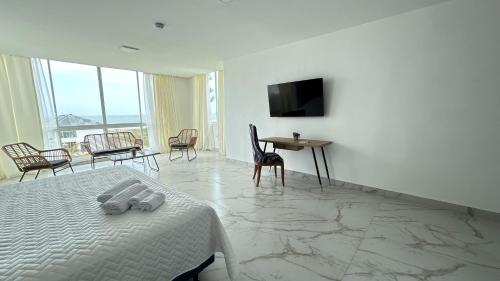 TV a/nebo společenská místnost v ubytování Hotel Presidente Beach Playas