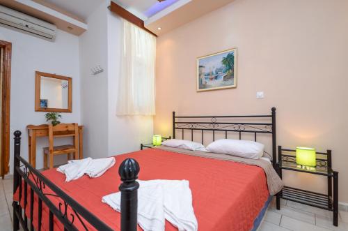 a bedroom with two beds in a room at Infinity Apartments in Naxos Chora