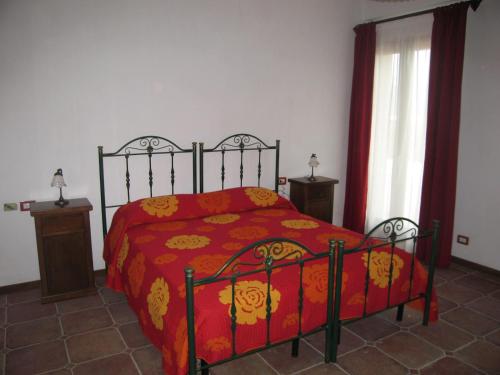 Ένα ή περισσότερα κρεβάτια σε δωμάτιο στο Agriturismo Biorussi