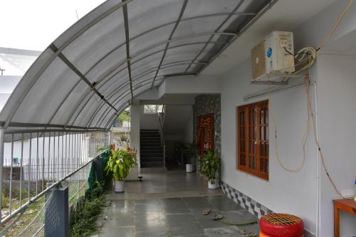 an external view of a house with an open ceiling at coco view in Port Blair