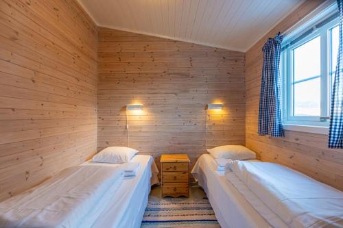 Ein Bett oder Betten in einem Zimmer der Unterkunft Henningsvær Rorbuer