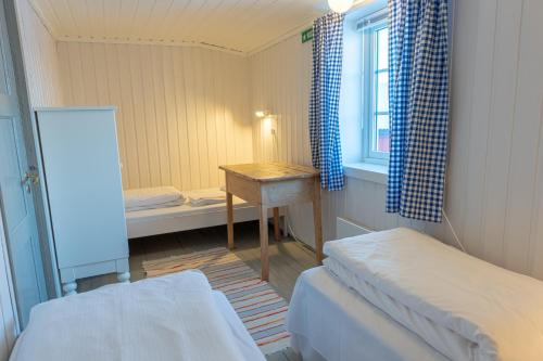 Ein Bett oder Betten in einem Zimmer der Unterkunft Henningsvær Rorbuer