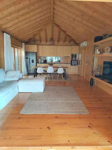 a living room with a couch and a table at A Casa da Japoneira CB in Rebordões