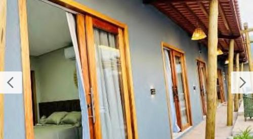 a room with a window with a bed in it at Casa Parque Minas in Córguinho